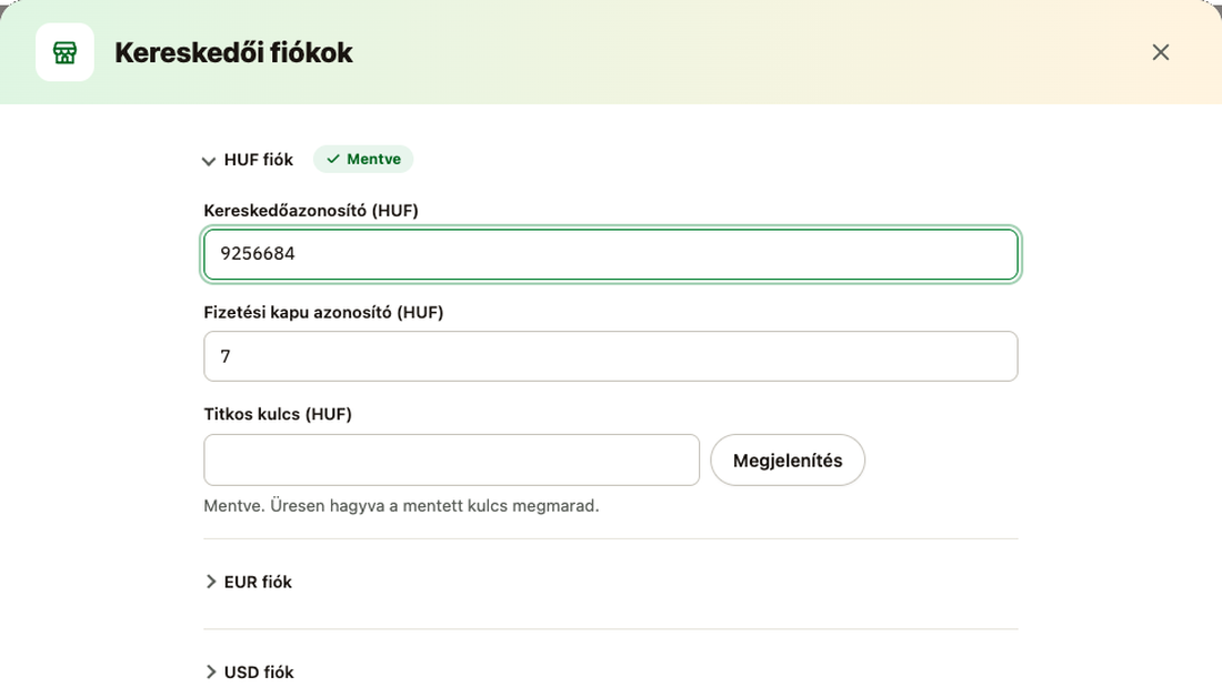 Kereskedői fiókok ablak: kereskedőazonosító, fizetési kapu azonosító és titkos kulcs pénznemenként